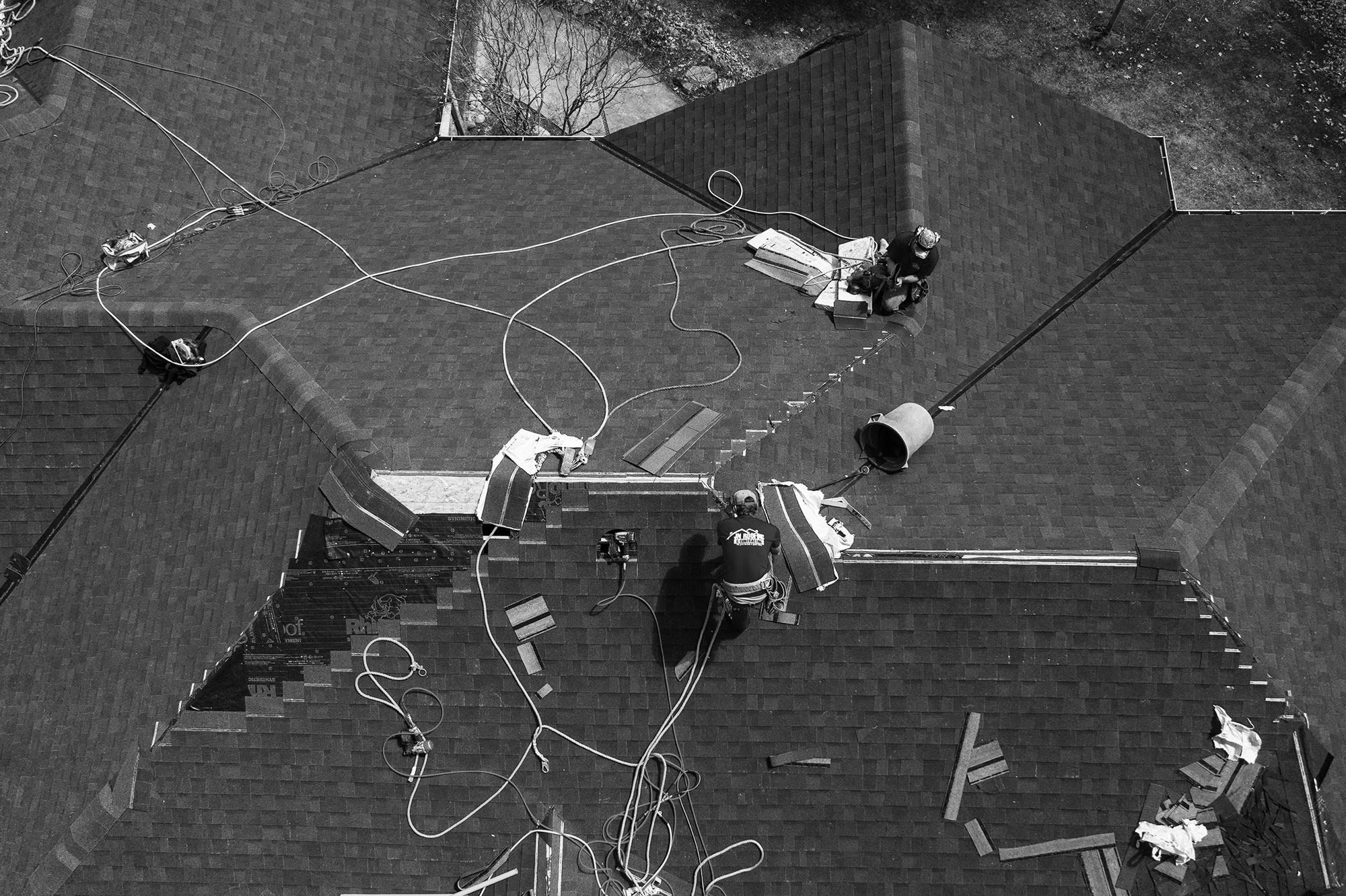 JN Roofing and Contracting employees doing a Reroof